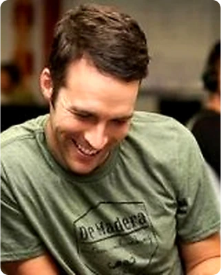 Professional headshot of Trevor Hussey, Revenue Operations leader at Watershed, in a modern office setting